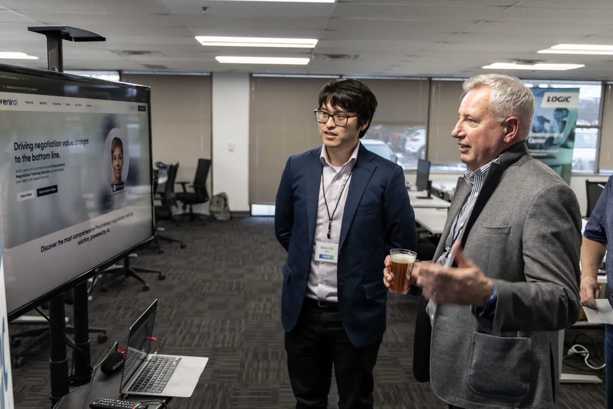 Bou-Yu, Logic Director of AI, walking a guest through a live AI demo at a Logic Tech Event